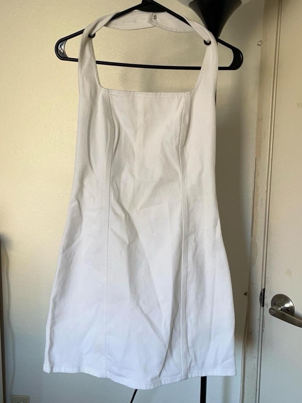 White denim mini halter dress.